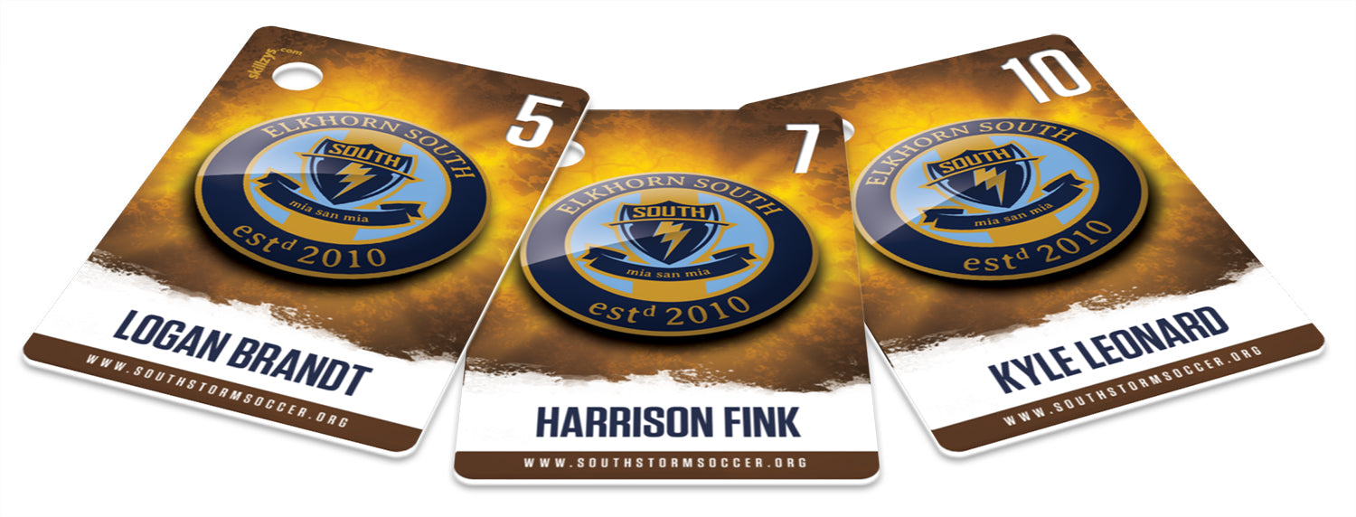 Three printed Elkhorn South soccer tags, each with a player name and jersey number pulled from the roster